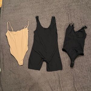 SKIMS Tan Bodysuit and two black Shapewear pieces - set of three
